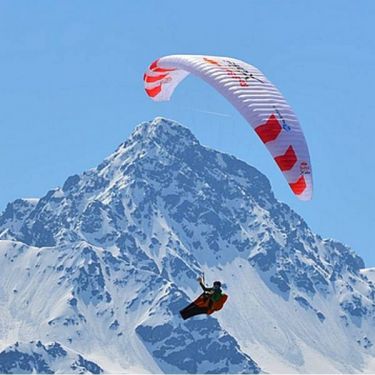 Phi MAESTRO light lightweight paraglider in standard colour White/Red, with Red Bull X-Alps and other sponsor logos.